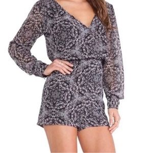 Pattered black BCBG long sleeve romper